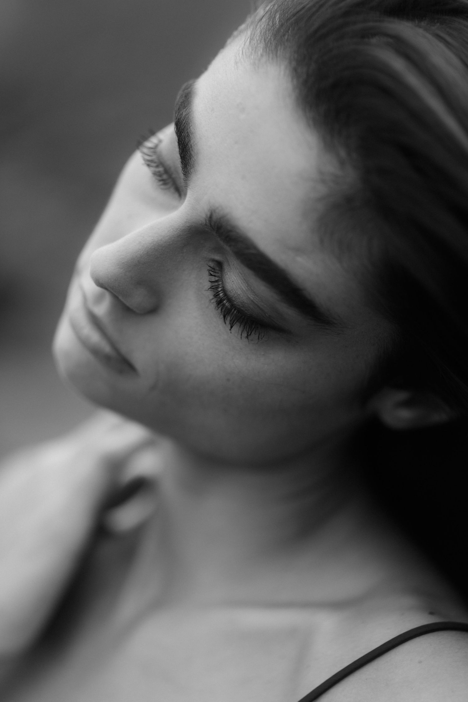 Dreamy black and white close-up portraits showing soft focus and dramatic angles.