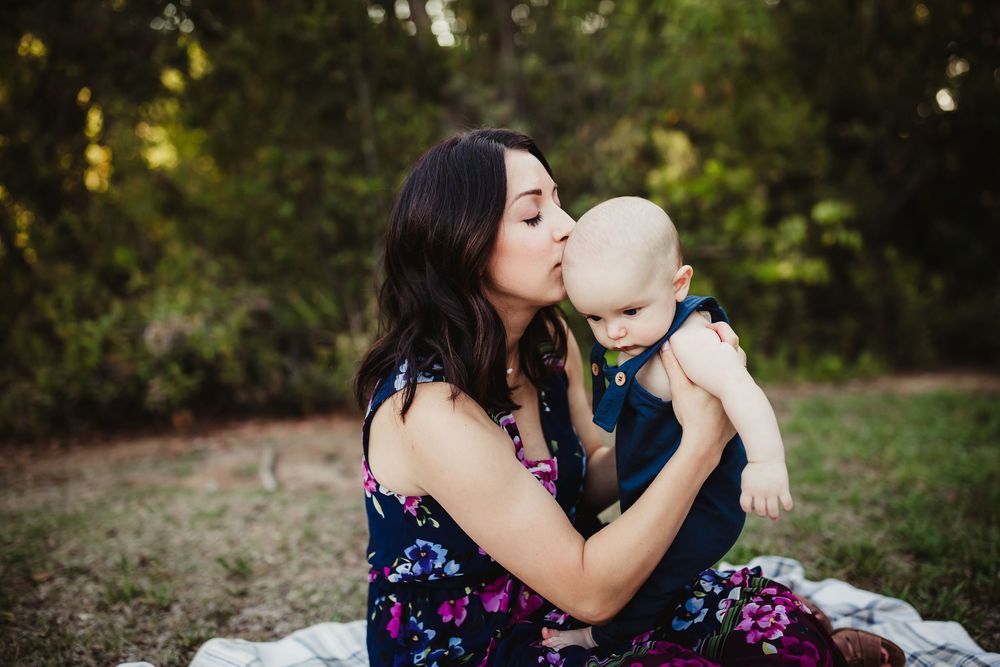 A series of intimate family portraits showing nurturing moments between parent and child in a garden setting.