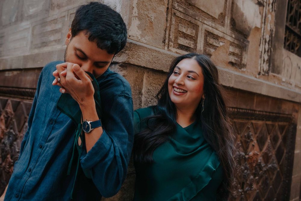 Owais whispering a joke to Sara making her smile brightly.