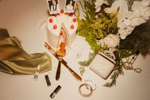 Wedding accessories including jewelry, floral arrangements and decorative items in warm vintage tones.