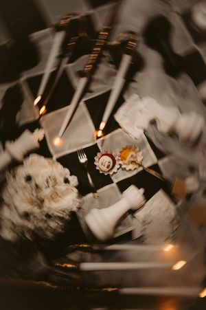 Abstract blurred motion photography of table settings with warm lighting effects.