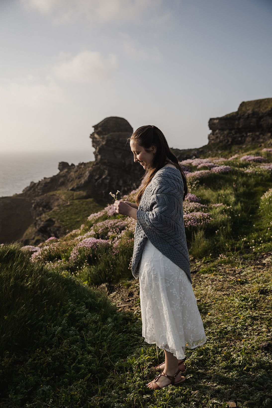 Intimate wedding portraits in blooming coastal flowers at Hags Head Cliffs of Moher