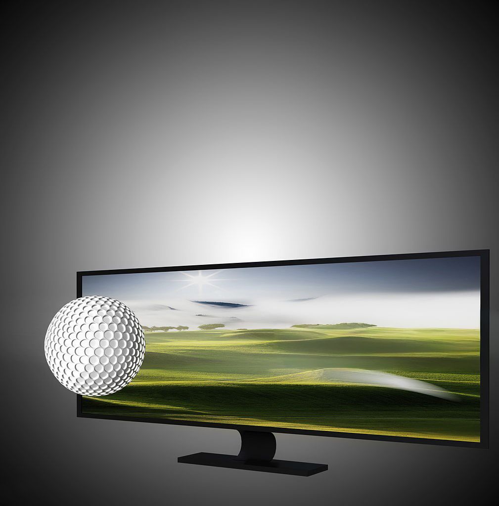 Golf ball in motion showing trajectory trail against blurred green course background and dramatic lighting effects.