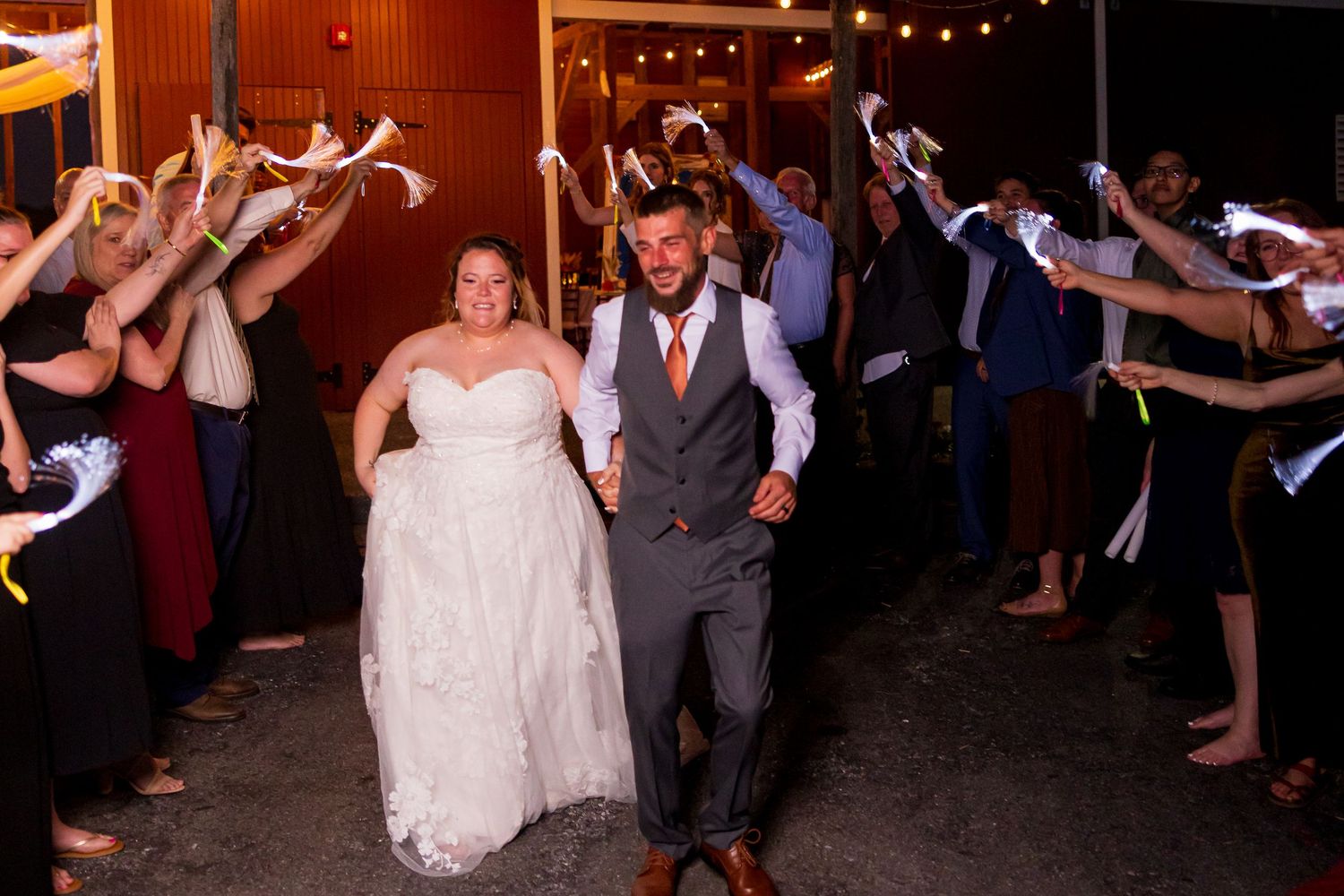 frederick maryland wedding photographer Wedding party and guests form a tunnel for the newlyweds' grand exit.