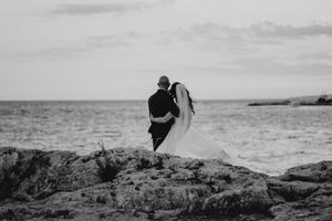 A black and white panoramic photo series shows rocky coastal landscapes and ocean waves meeting the shore.
