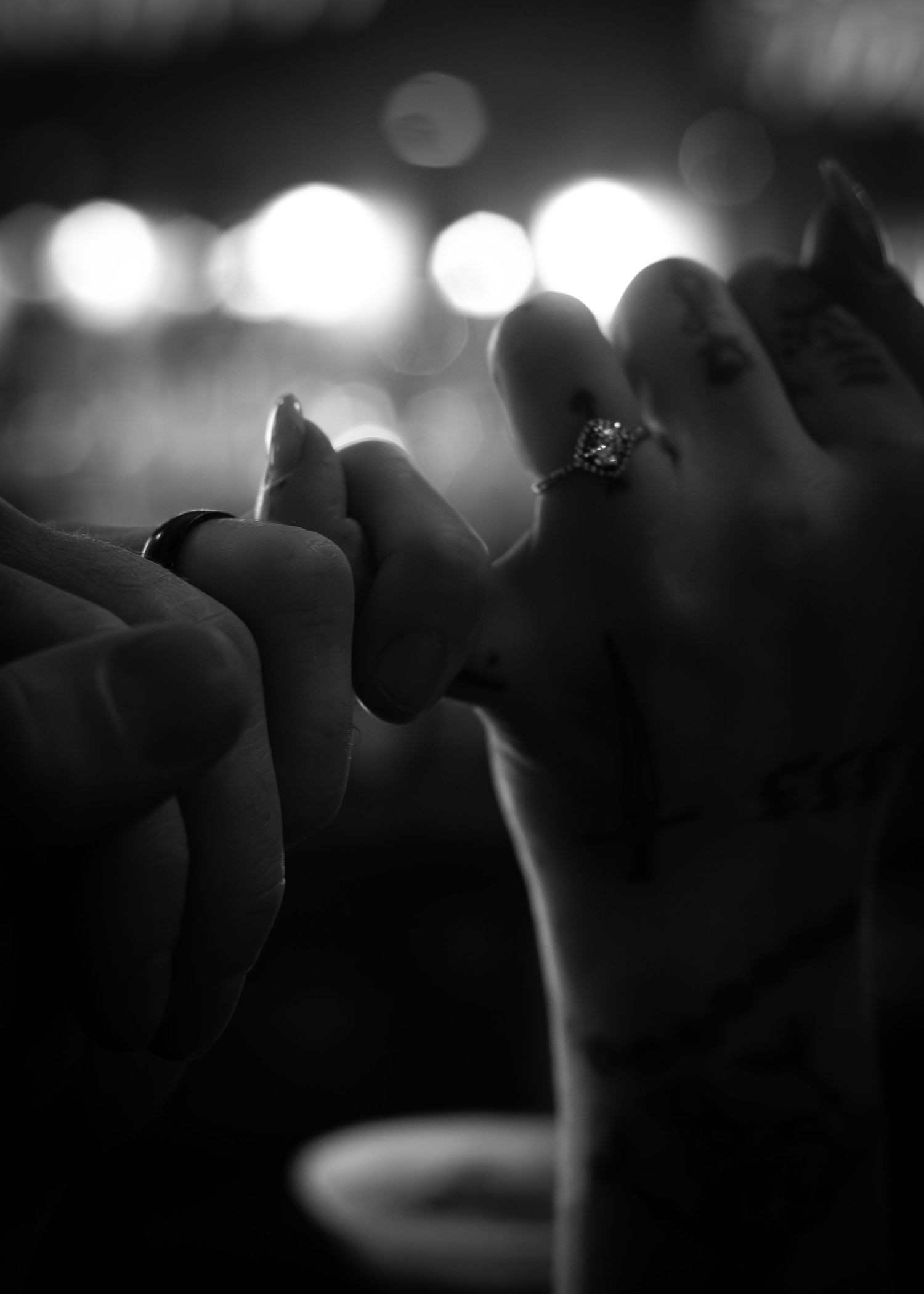 Pinky swear with engagement rings.