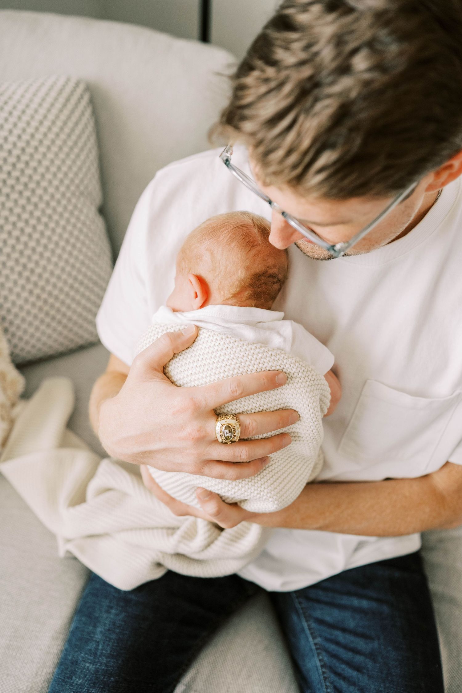 Lifestyle newborn session with parents in Frisco, Texas