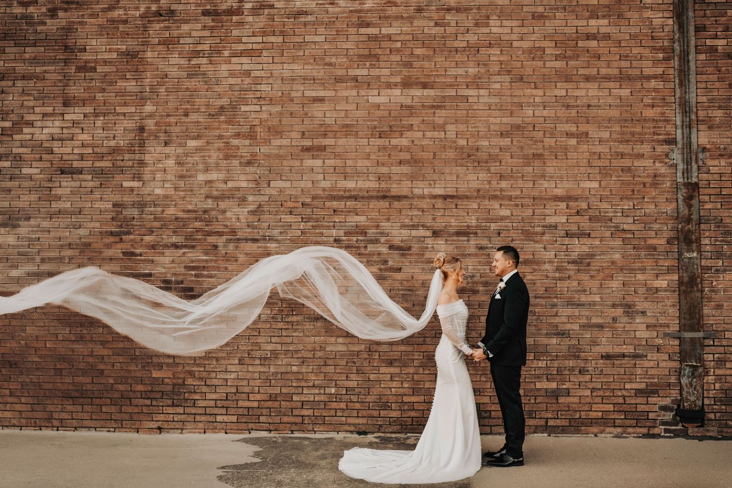 Editorial bride and groom portrait with modern architecture