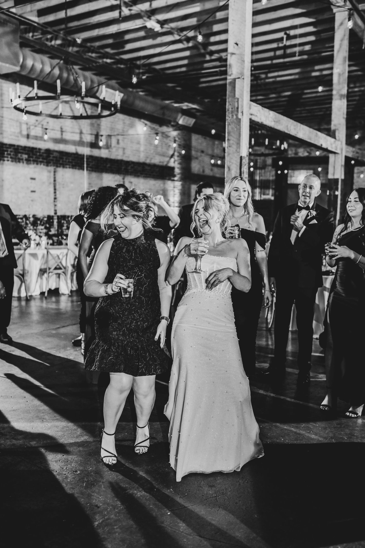 Guests dancing enthusiastically during live band reception