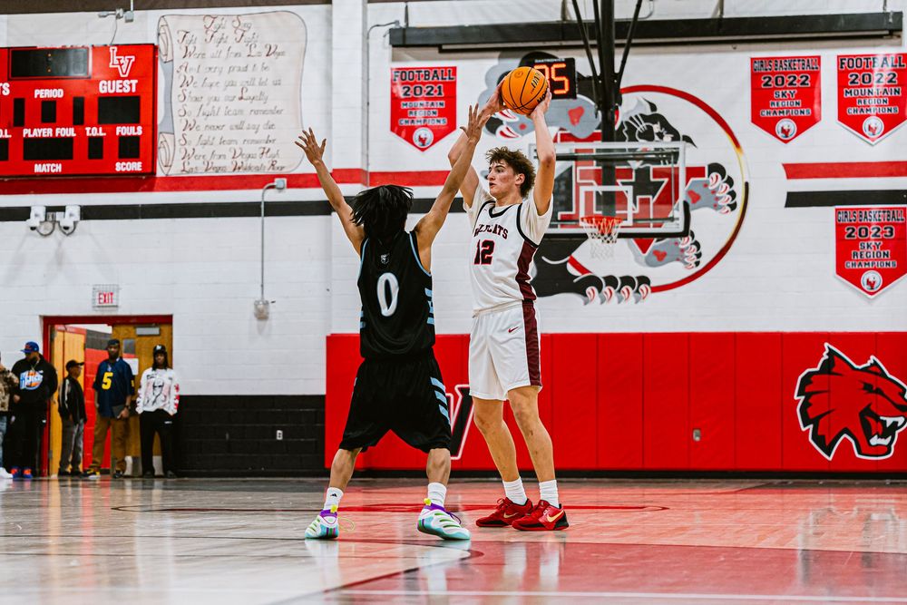 Mens Basketball Player overhead passing a basketball