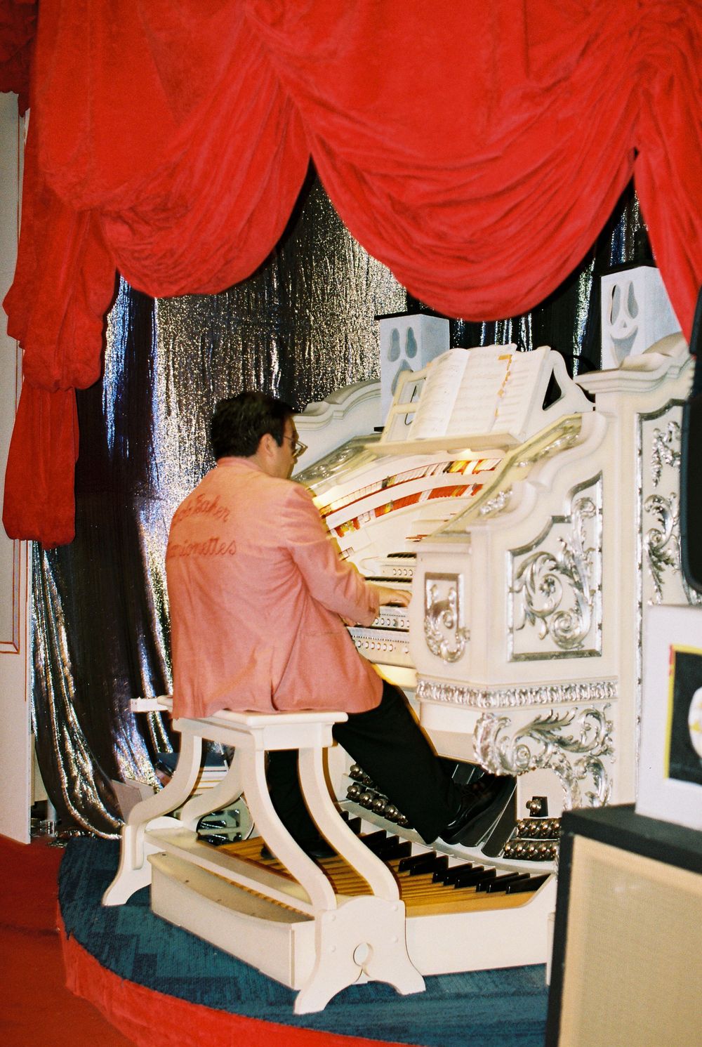 Organ player plays music before Bob Baker wedding ceremony