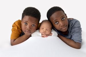 Newborn baby photographer east cork photography with siblings