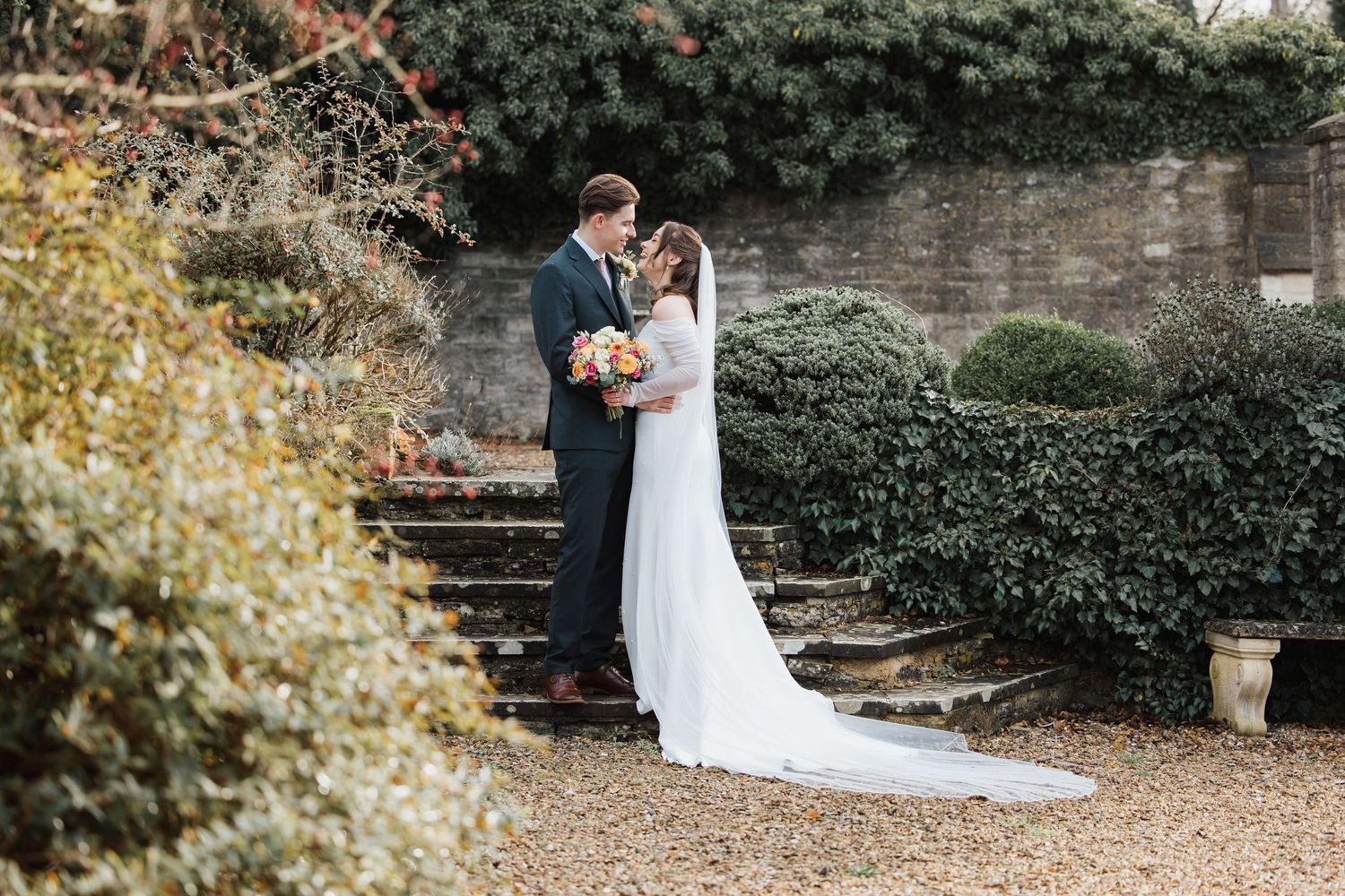 Old Swan & Minster Mill Wedding Photography with Bride and Grooms looking towards each other