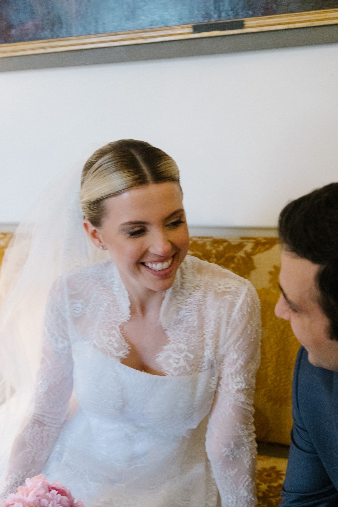 A couple in wedding attire share an intimate moment together during their special day.