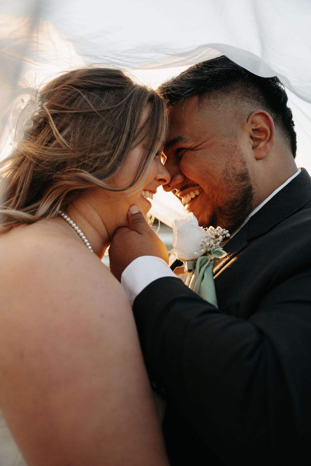 Intimate close-up shots of a romantic wedding couple sharing tender moments at sunset.
