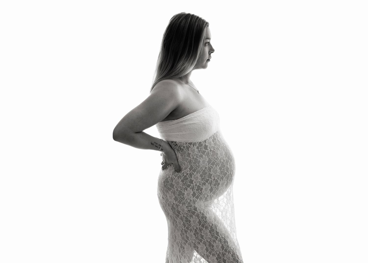Maternity Photography Melbourne, a black and white photo sequence shows a pregnant woman in a lace dress posing from different side angles.