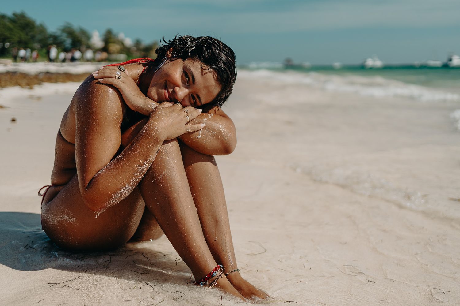 Beach scene with sand and ocean waters visible under blue sky photoshoot in Puerto Morelos.