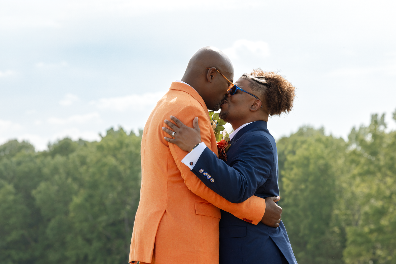 Joyful wedding couple sharing an intimate moment together in elegant black and white photography.