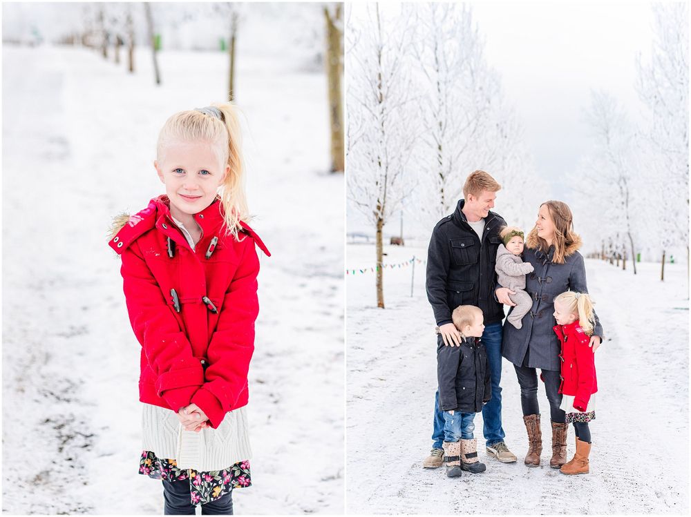 Winter family portraits in snow with child wearing bright red coat.