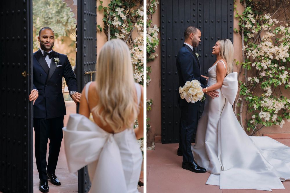 Romantic first look between bride and groom at ornate doorway with flowering vines at wedding ceremony.