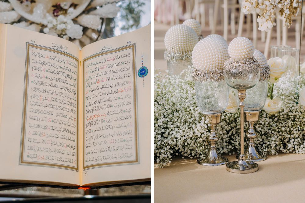 An open Arabic text or Quran book displayed next to elegant pearl-decorated glass centerpieces at a wedding reception.
