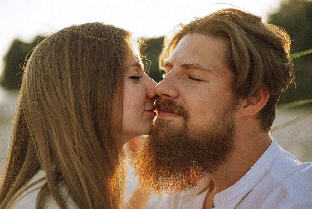 Sun-drenched outdoor portrait sequence capturing tender moments at golden hour.