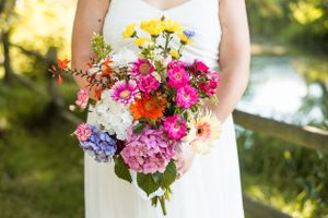 A bride's bouquet consisting of beautiful, colourful wildflowers. Photo taken in Delta, BC by Kari Mills Photography.