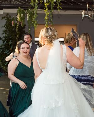 Wedding guests and the bride having fun on the dance floor in Chilliwack, BC.