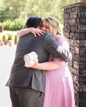 A groom hugs his mom tight. Photo taken by Kari Mills Photography in Chilliwack, BC.