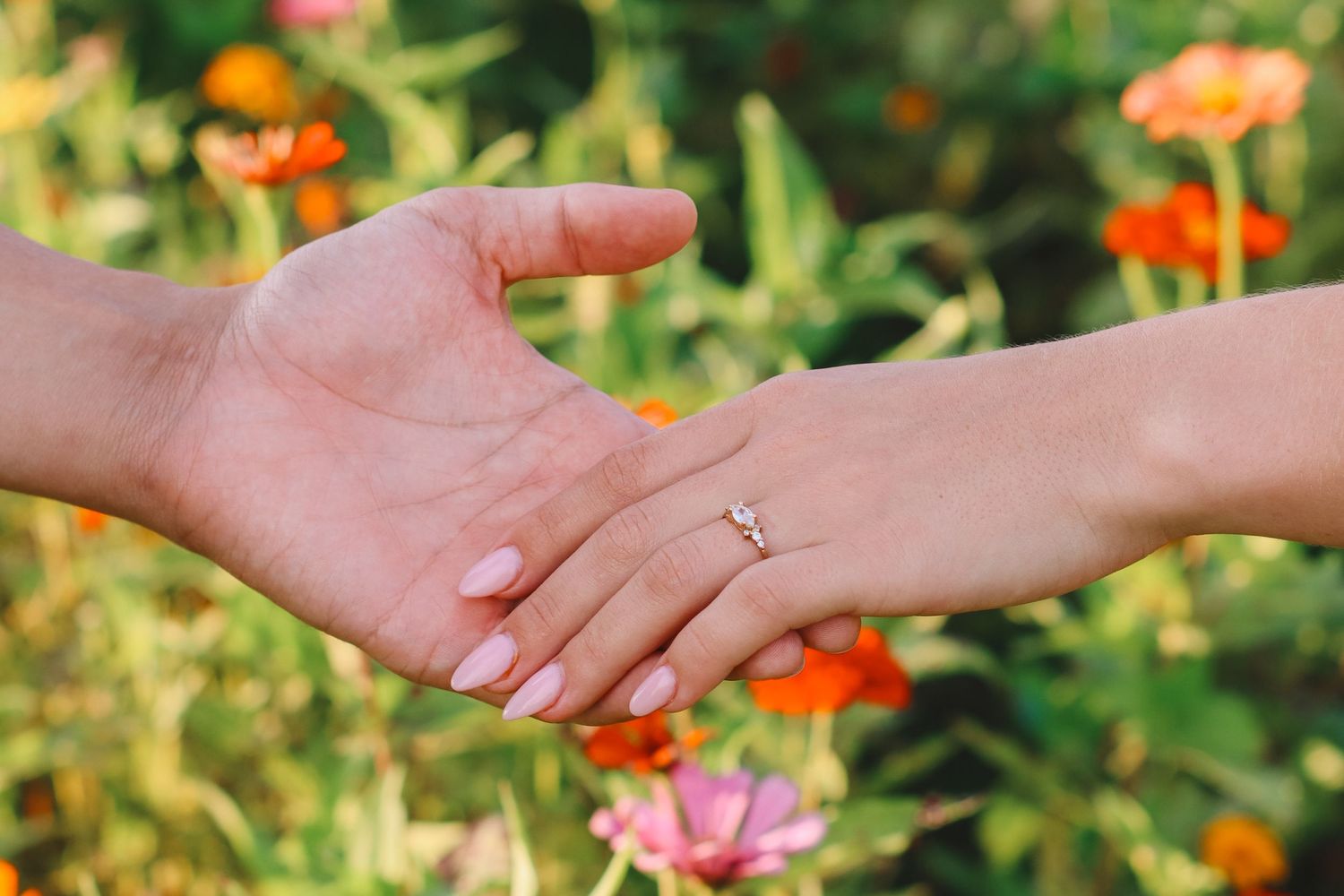 couple hands with engagement ring