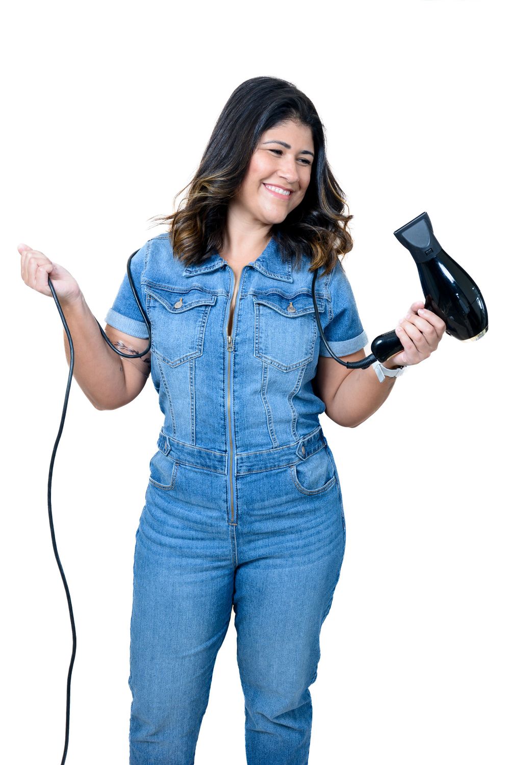 Playful denim jumpsuit photoshoot sequence against white backdrop.