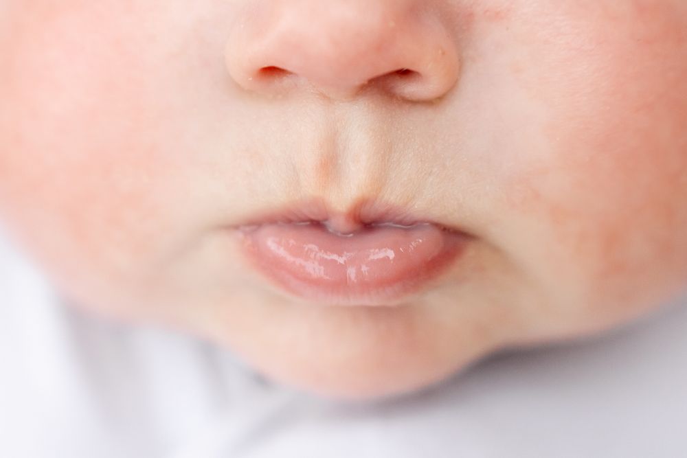 pucker of a baby's lips for a newborn photo of the small macro photo of lips