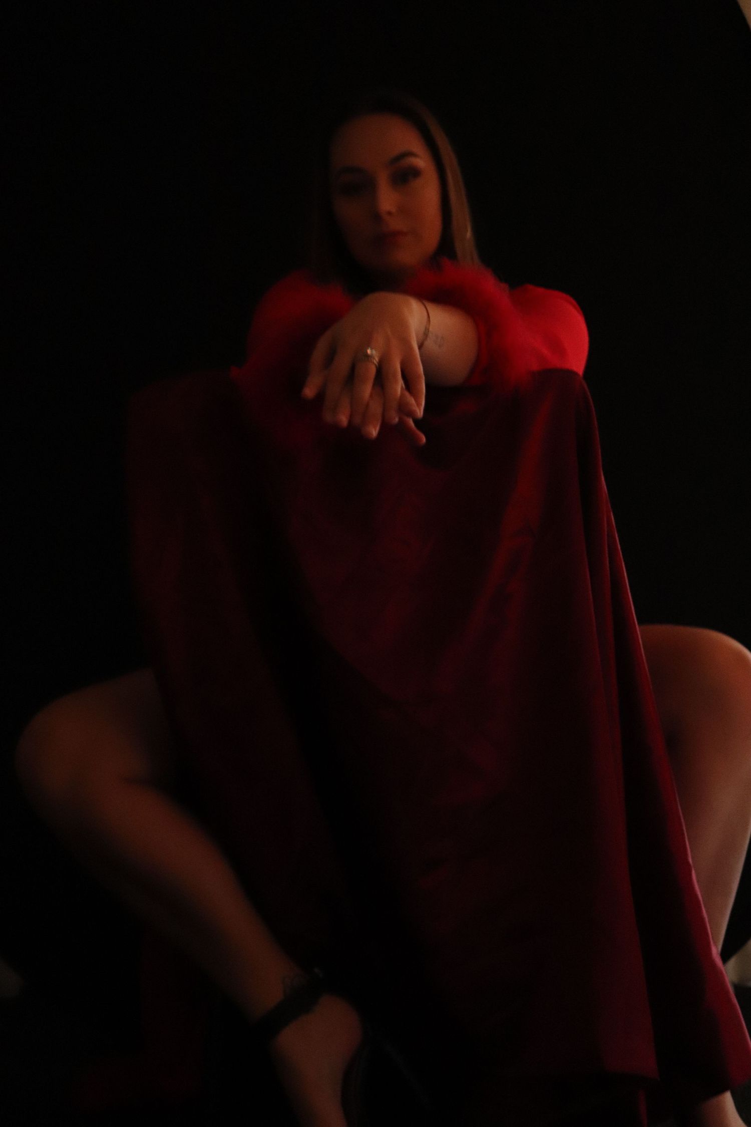 A woman posing for a boudoir photo