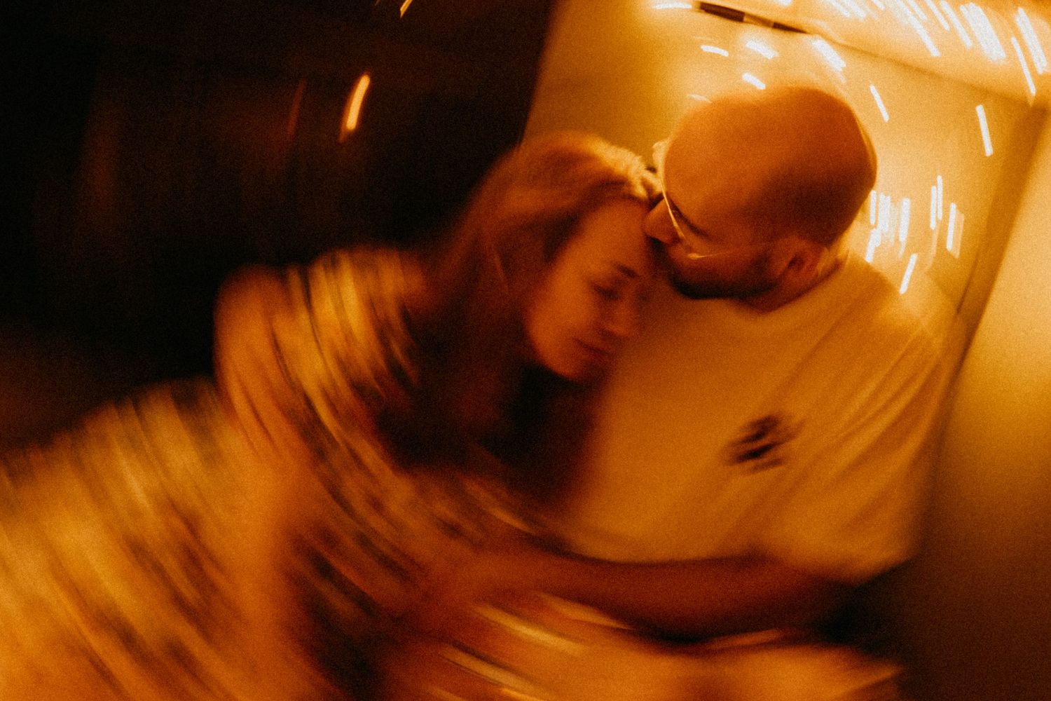 Blurred artistic photograph with warm golden lighting creating dreamy atmosphere.