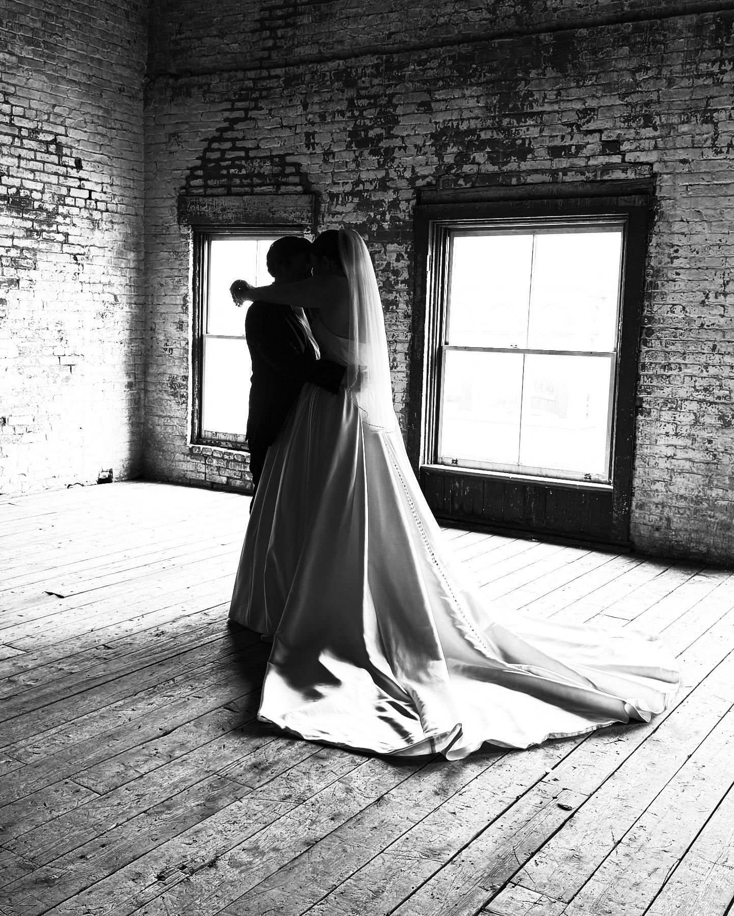 A haunting black and white photo sequence shows a ghostly figure in a dress moving across a sunlit wooden floor.