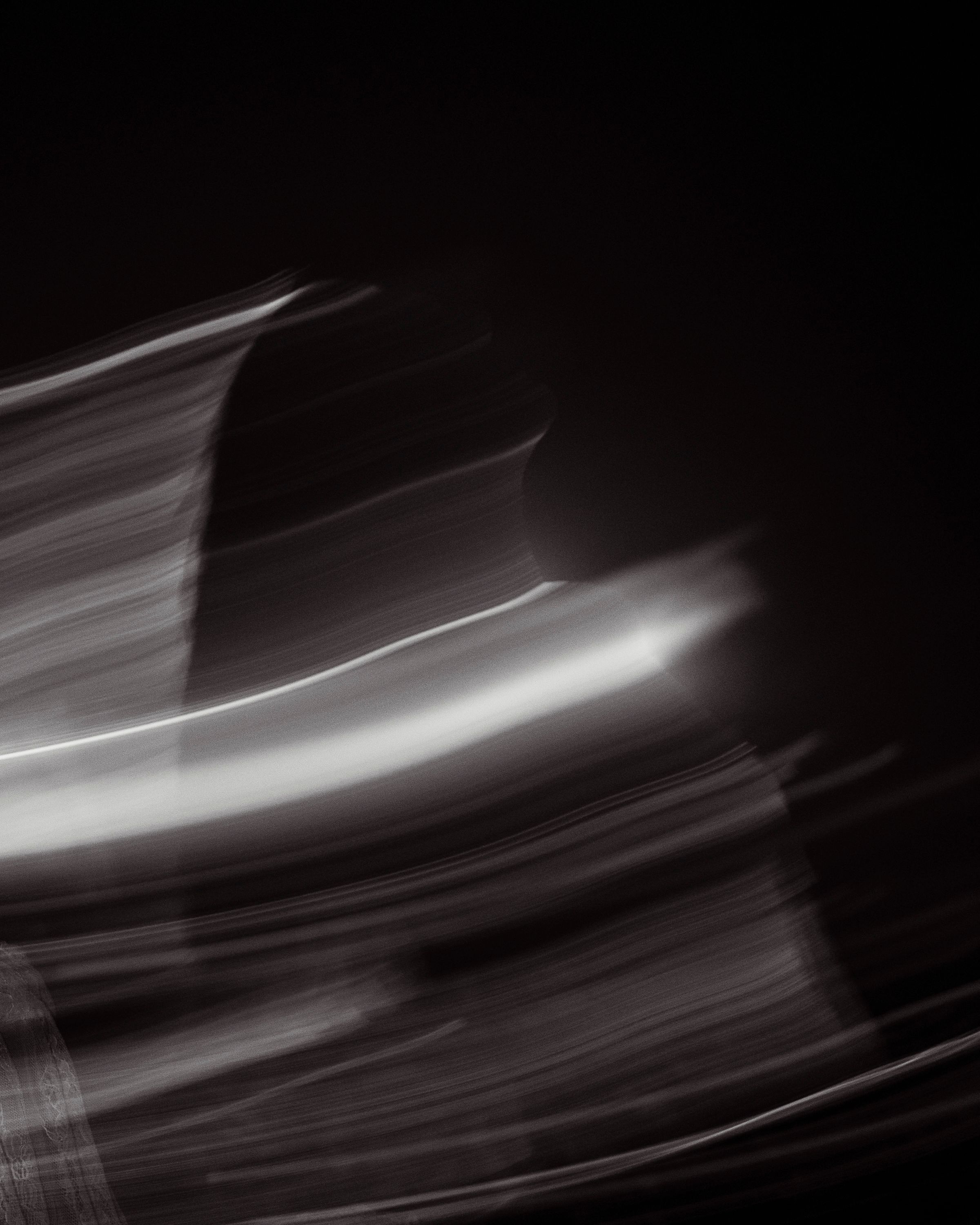 Model posed with dramatic light and motion blur