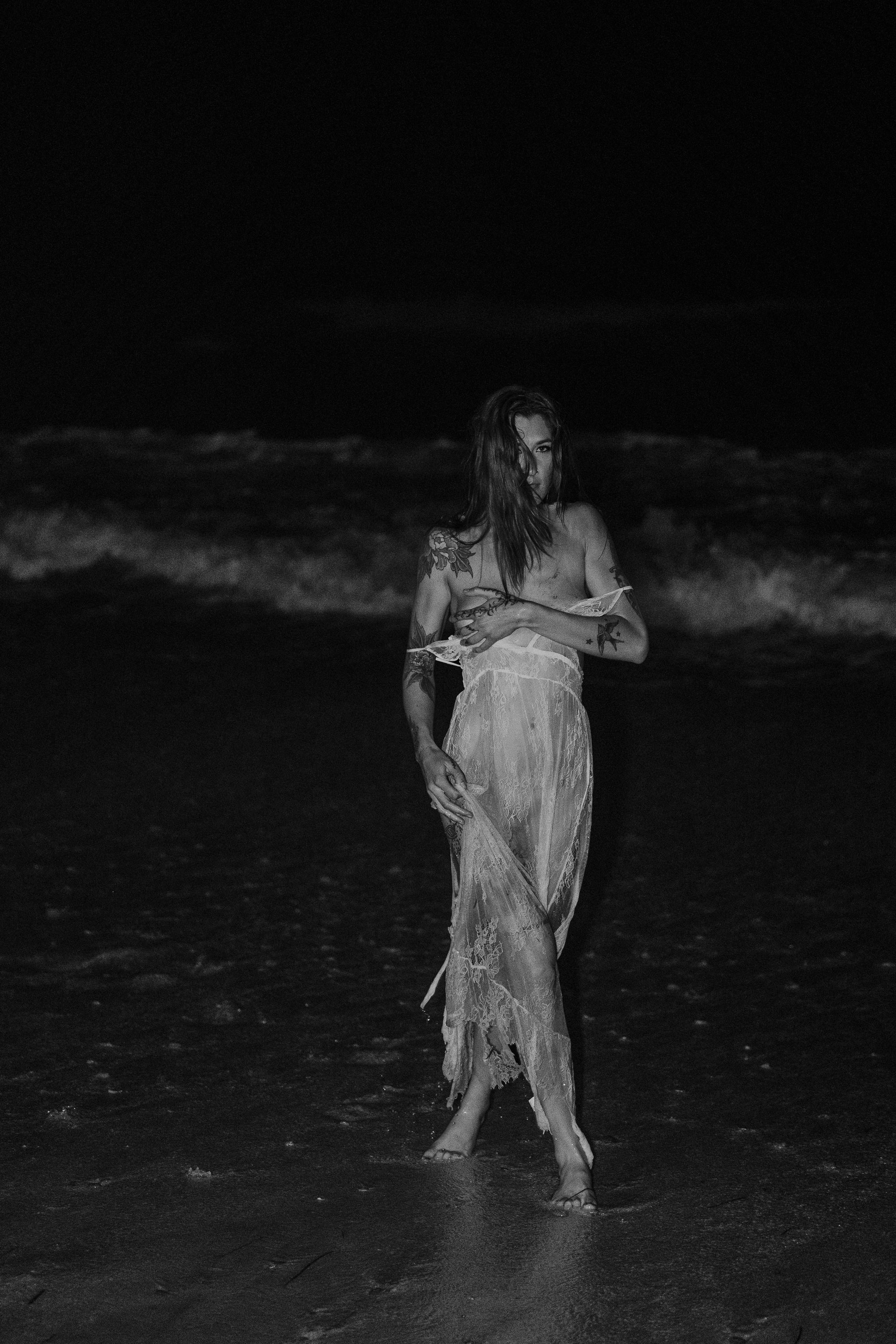 Model posed at night on beach i