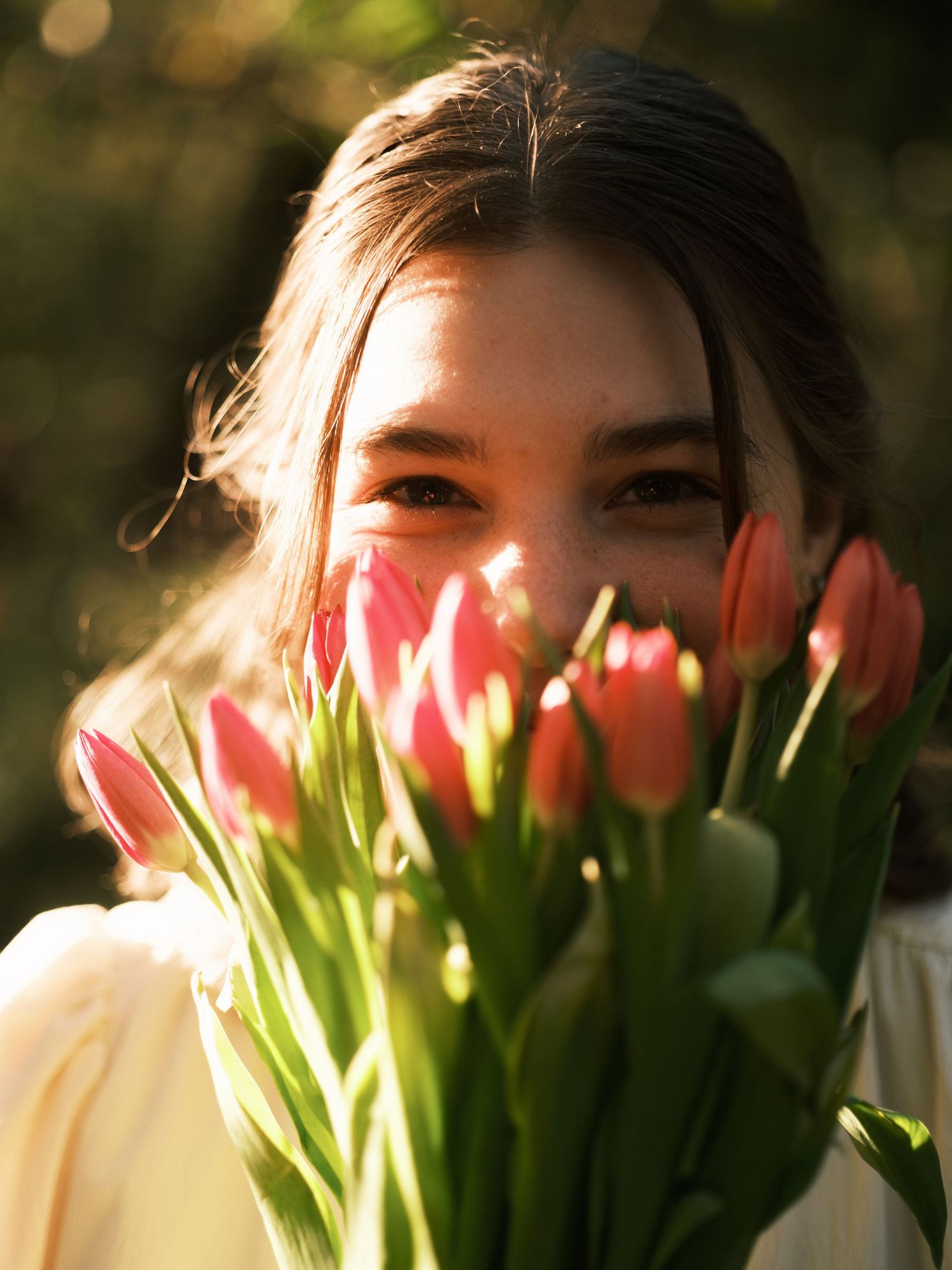 ©Stone Robinson , Portrait of Anna VonRiesen at Anna VonRiesen Photography | Color image of a girl holding tulips