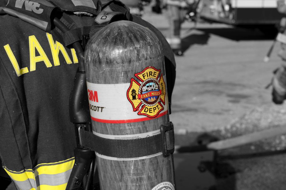 Fire department oxygen tank with LAFD logo shown in selective color photography.