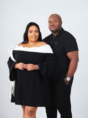 A couple wearing black outfits poses together in a series of playful photos against a white background.