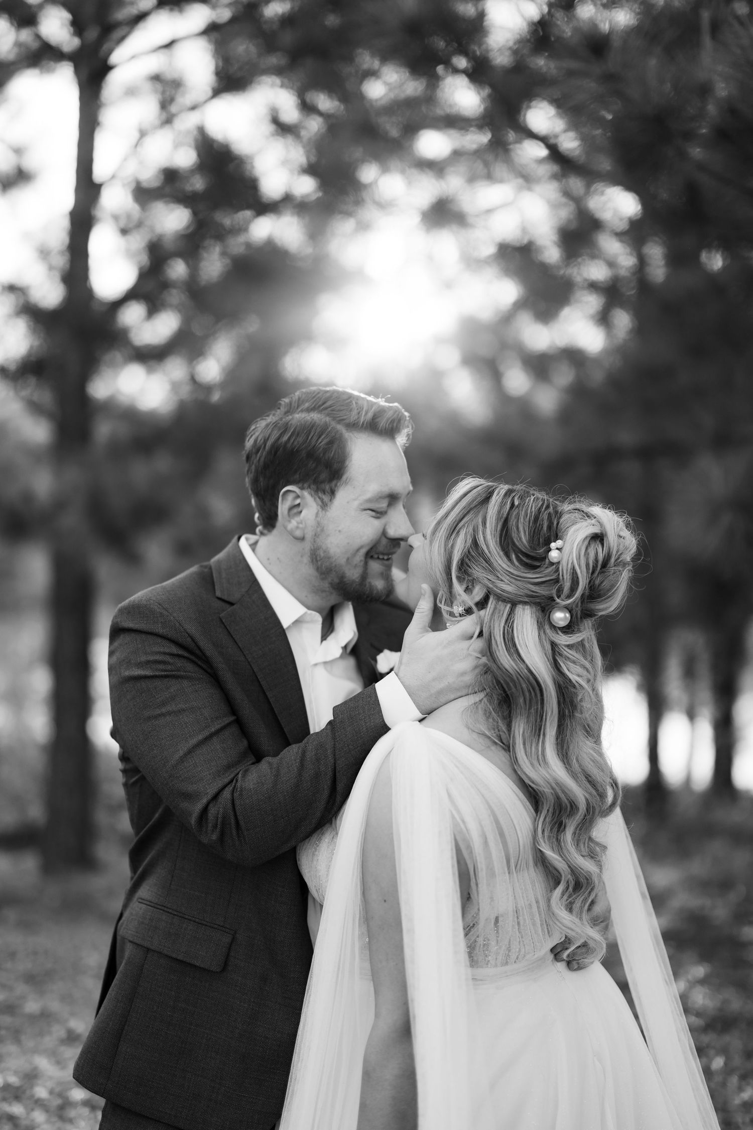 A couple shares their first dance under a disco ball at their wedding reception.