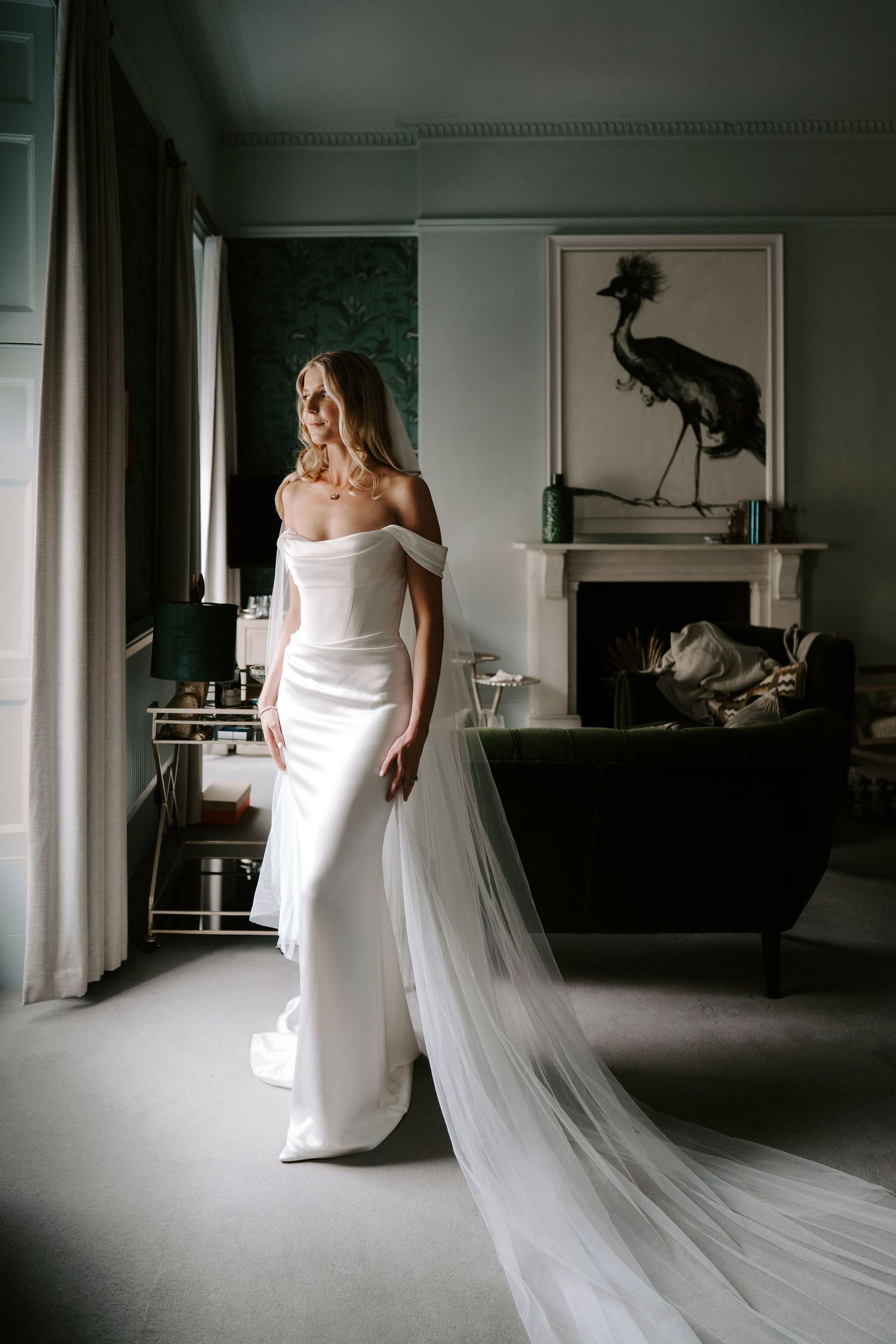 bride looking out window at the Queensbury hotel in bath