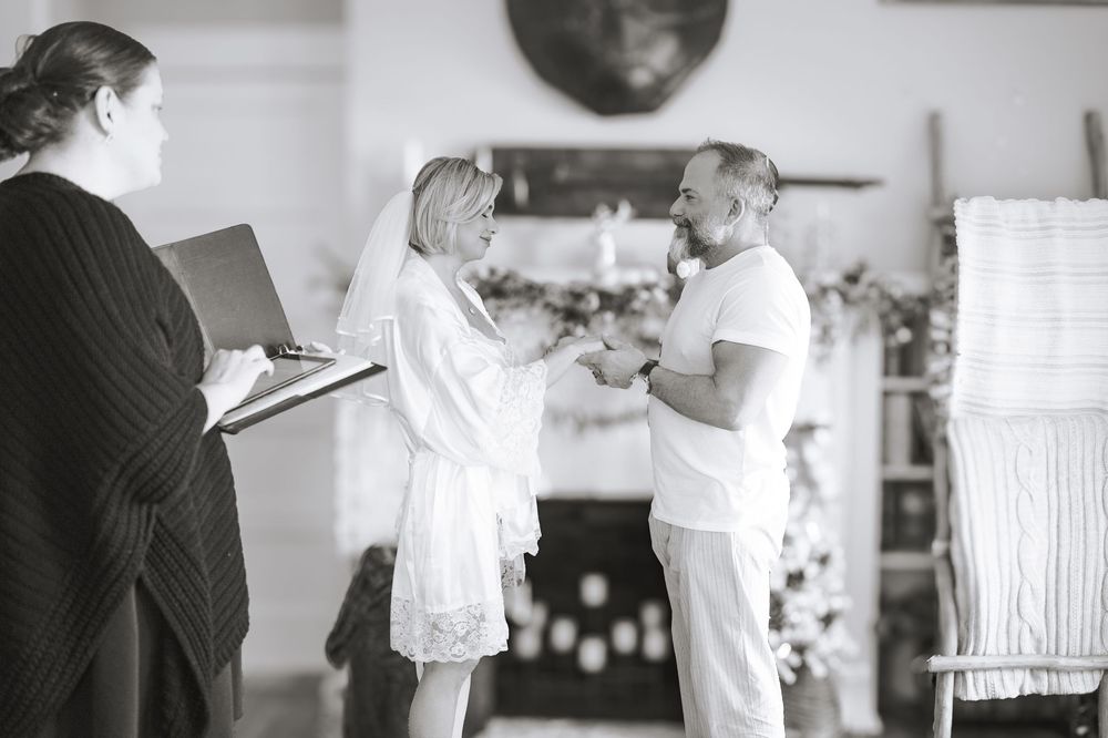 A sequence of black and white photos showing a couple dancing together in a room.