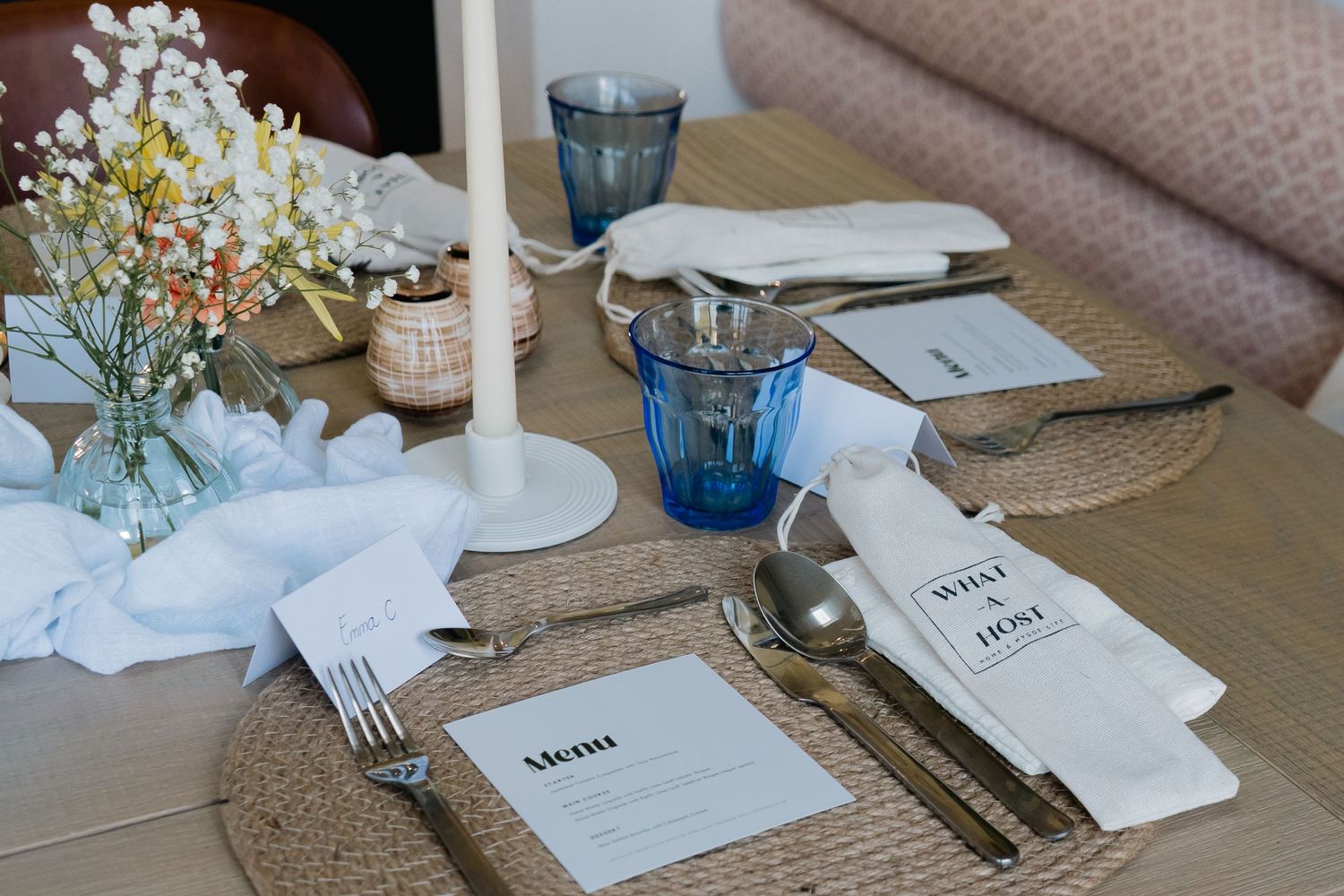 details from an event styled table with florals, candle sticks and menu cards for event photography