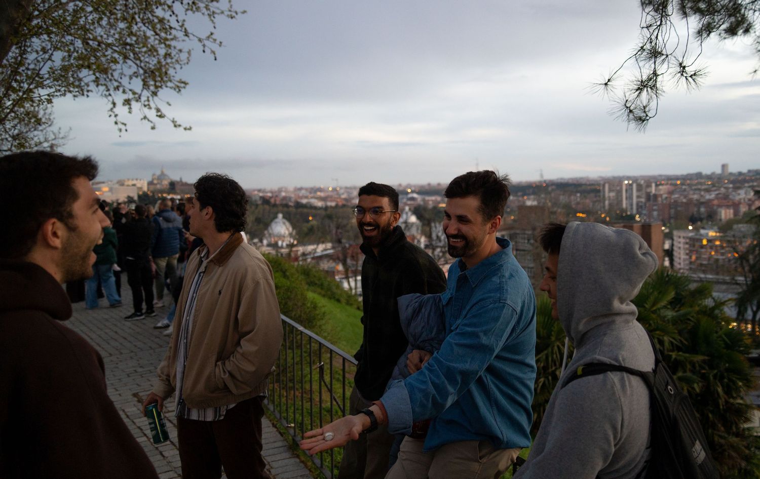 Scenic mountain overlook with visitors enjoying the panoramic view.