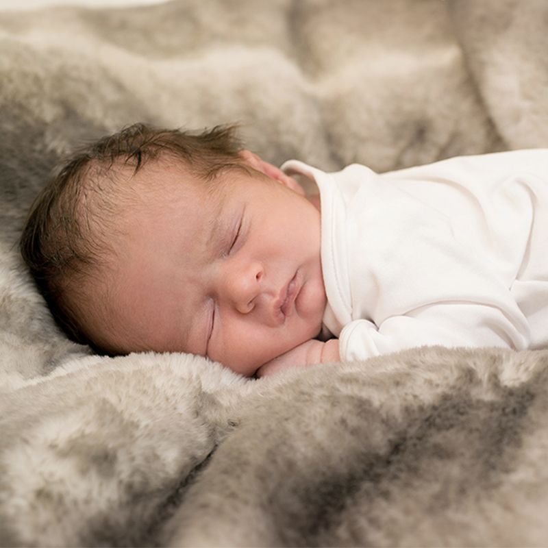 Newborn baby sleeping peacefully during a Buckinghamshire photography session photography by Abigail's Studio