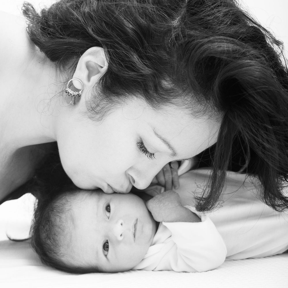 Photographer at Abigail's Studio  capturing emotional first moments between mother and baby  Newborn photography in Buckinhasmshire