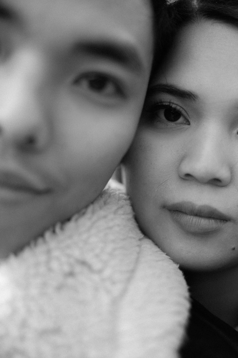 An intimate black and white close-up portrait of two people. Copenhagen, Denmark.