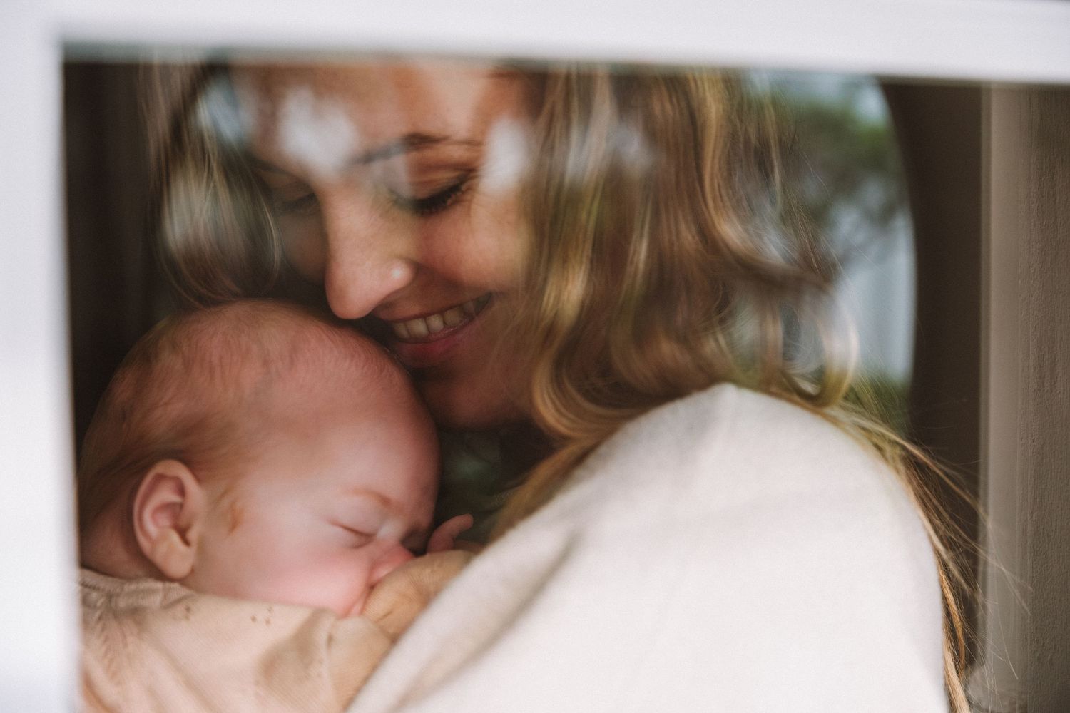 Newborn Photography - Close up of Mom holding her baby girl in Narrabeen, Northern Beaches, Sydney