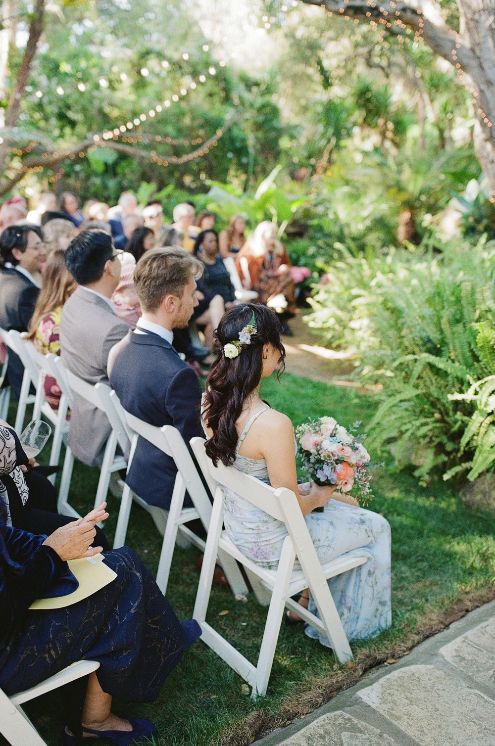 Wedding ceremony on film photography at lush garden ceremony similar to NC wedding venue.